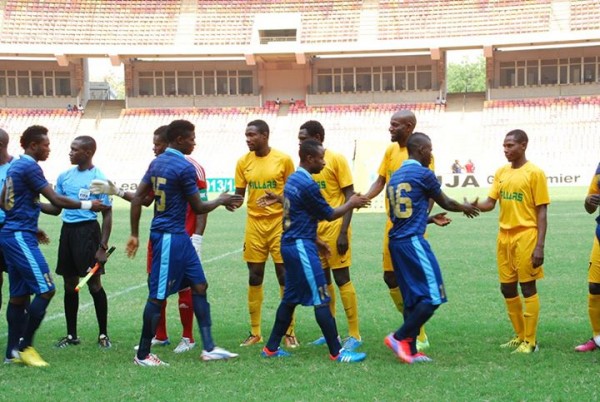 Kano Pillars Players Exchanges Pleasantries With Their Bayelsa United Counterparts During the Super Four Tourney in Abuja.