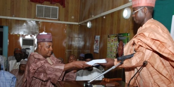 GOVERNOR KASHIM SHETTIMA OF BORNO STATE PRESENTING THE 2014 APPROPRIATION BILL TO THE SPEAKER OF THE HOUSE OF ASSEMBLY, HON. ABDULKAREEM LAWAN.