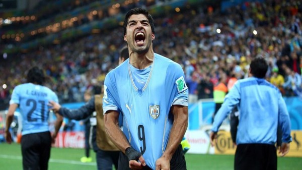 Luis Suarez Celebrates His Brace Against England at the World Cup. Getty Image.