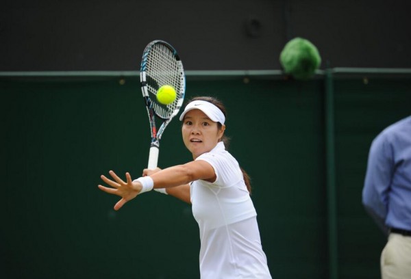 Li Na Returns Serve During Her Second Round Win Over Yvonne Meusburger at Wimbledon This Year. Image: AELTC. 