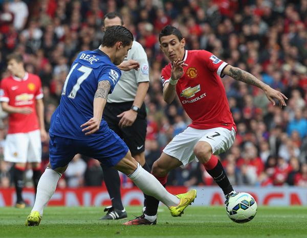Angel Di Maria Tries to Beat Muhamed Besic. Image: Getty.