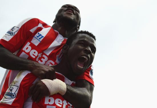 Mame Biram Diouf Celebrates With Victor Moses at the Etihad Stadium. Image: Getty.