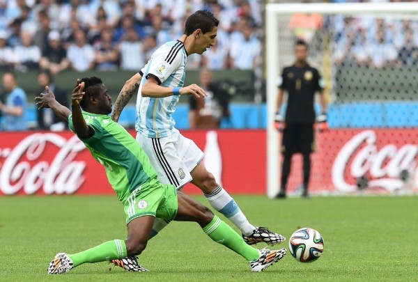 Babtunde Michael Tackles Manchester United's Angel Di Maria in a Group Game at the 2014 Fifa World Cup. Image: JEWEL SAMADJEWEL SAMAD/AFP/Getty.