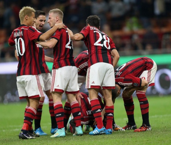 Sulley Muntari Surrounded By Milan Team-Mate After Opener. Image: Getty.
