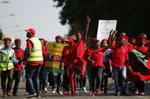 Supporters of Malema, expelled ANC youth leader and current leader of the EFF political party, chant slogans outside Polokwane High Court