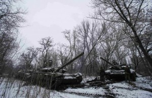 Pro-Russian separatists stand next to tanks on the outskirts of Horlivka, eastern Ukraine